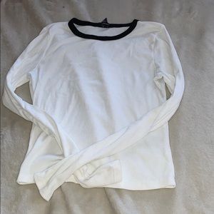 white long sleeve with black skeins neck